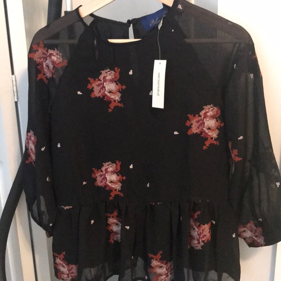 Black patterned peplum top. - Picture 1 of 2